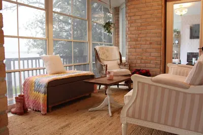 a room with a bed and two chairs and a table at Guest Suite w Ensuite Waterfront in Belleville