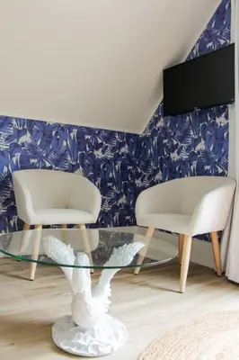 two chairs and a glass table in a room at Guest Suite w Ensuite Waterfront in Belleville