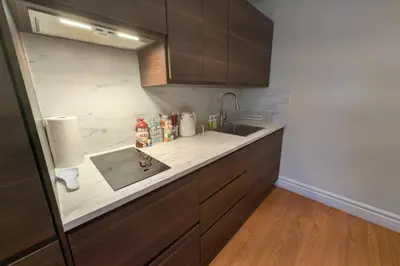 a kitchen with a sink and a counter top at Elegant & Stylish Apartments with Private Entrance & Parking in Richmond Hill
