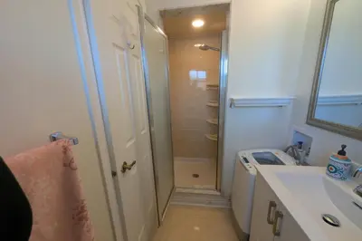 a bathroom with a shower and a sink at Elegant & Stylish Apartments with Private Entrance & Parking in Richmond Hill
