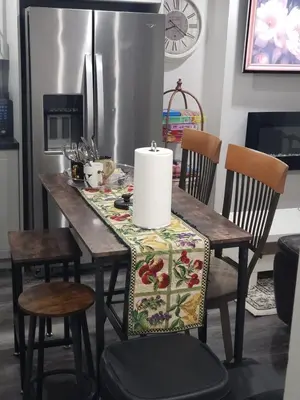 a dining room table with chairs and a candle on it at Velohome - 3-Bed, 2-Bath Home in Milton
