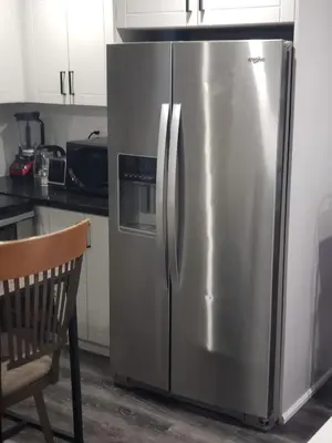 a stainless steel refrigerator in a kitchen at Velohome - 3-Bed, 2-Bath Home in Milton
