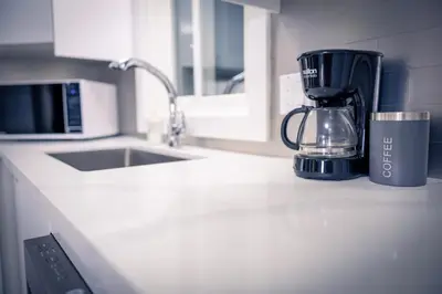 a kitchen counter with a blender on a counter top at Cozy Barrie Home - Minutes to College & Hospital in Barrie