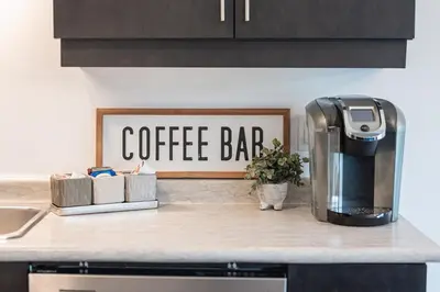 a coffee bar sign on top of a kitchen counter at Luxury Living 5 mins from the Falls in Niagara Falls