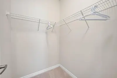 a bathroom with a white wall with a towel rack at Modern 5 Bed Home Near Burlington Pier, Downtown, Hospital, GO in Burlington