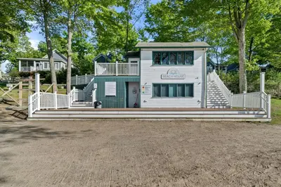 a house with a staircase leading up to a playground at The Marmot - 12 Butternut in Cherry Valley