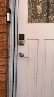 a door with a clock on it next to a building at B3 Luxury home in Mississauga nearby shipping center square one in Mississauga