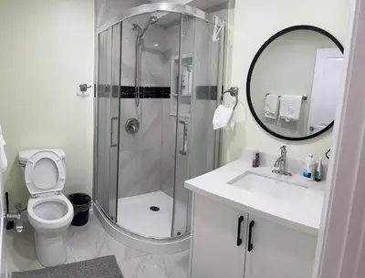 a bathroom with a shower and a toilet and a sink at B3 Luxury home in Mississauga nearby shipping center square one in Mississauga