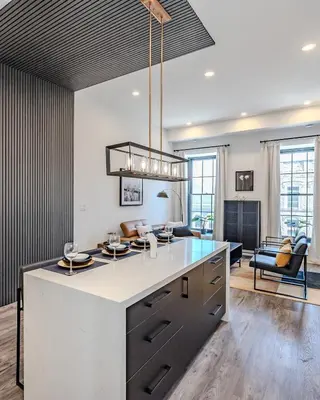 a kitchen with a large island in the middle of a room at Charming 2 Bed Apartment in Cambridge