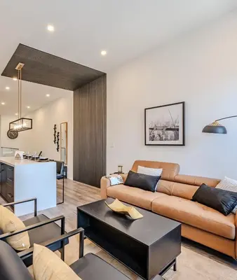 a living room with a couch and a table at Charming 2 Bed Apartment in Cambridge