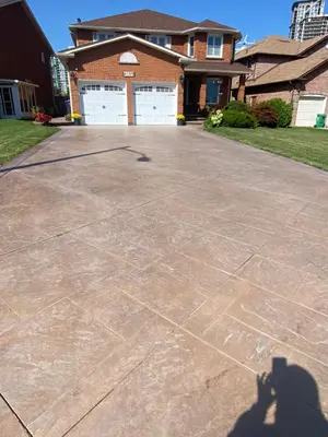 a shadow of a person taking a picture of a driveway at F3 Spacious room with 2 queen beds and TV in Mississauga