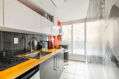 a kitchen with a sink and a large window at Modern City Suite with Rooftop Patios in Toronto