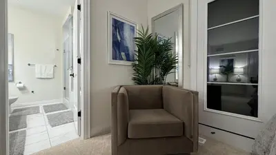 a chair in a room with a bathroom at Exquisite Luxury Townhomes in Elite Angus Glen Estate in Markham