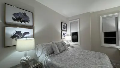 a bedroom with a bed and two windows at Exquisite Luxury Townhomes in Elite Angus Glen Estate in Markham
