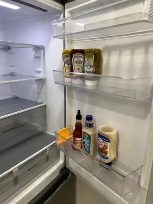 an open refrigerator filled with lots of food at Private 2bedroom Unit, Free Parking, Free from Smoke & Pet, Self-Check IN in Pickering