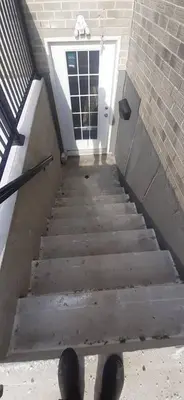 a stairway leading up to a door to a building at Private 2bedroom Unit, Free Parking, Free from Smoke & Pet, Self-Check IN in Pickering