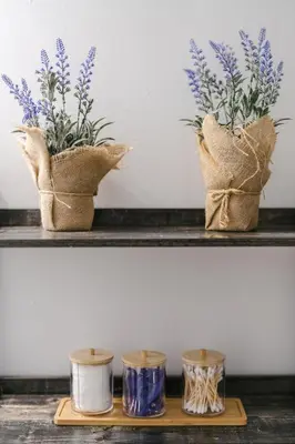 a couple of vases sitting on a shelf with flowers at Spacious 4 bedroom Home - 15 mins from YYZ airport in Mississauga