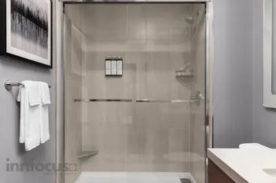 a shower with a glass door in a bathroom at Hyatt Place Mississauga / Airport Corp Center in Mississauga