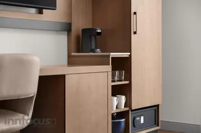 a small kitchen with a coffee maker and a microwave at Hyatt Place Mississauga / Airport Corp Center in Mississauga