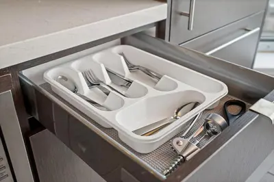 a tray with utensils in a drawer in a kitchen at Luxurious Suite in Yorkville in Toronto