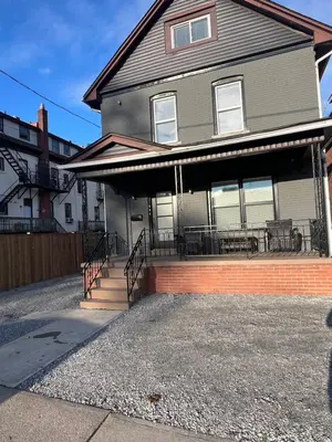 a house with a front porch with a patio at St Catharines Niagara Escape in St. Catharines