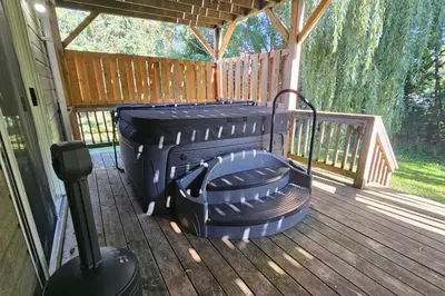 a grill sitting on a deck in a house at All-Season 8BR Vacation Chalet in Blue Mountains