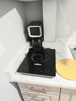 a kitchen with a slow cooker on a counter at Welcome to your Serene Gateway in London
