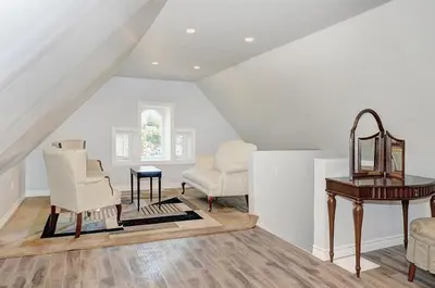 a living room with two chairs and a table at Luxurious Condo with Balcony in Kitchener in Kitchener