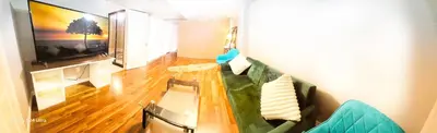 a living room with a couch and a television at 70 percent Off Luxurious Hot Tub,Sauna, 2000Sqft of Private in Vaughan
