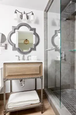 a bathroom with a sink and a mirror at La TUMU in Toronto
