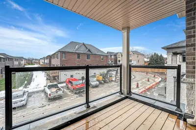 a balcony with a view of a construction site at Spacious 6bed Home near Pier Niagara Toronto QEW in Burlington