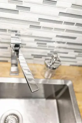 a kitchen sink with a faucet on top of it at Cozy & Stylish 2br W Hot Tub & Fireplaces in Mississauga