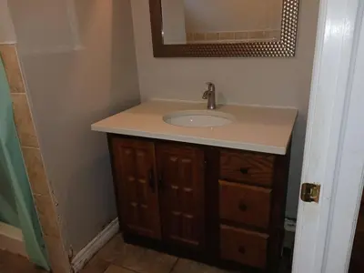 a bathroom with a sink and a mirror at Kitchener -WLU BNB-Minutes To University of Waterloo, Conestoga College,Buses,Airport in Waterloo