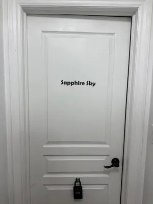 a white door with a sign that reads signaturestay at Dream Homes in Thorold