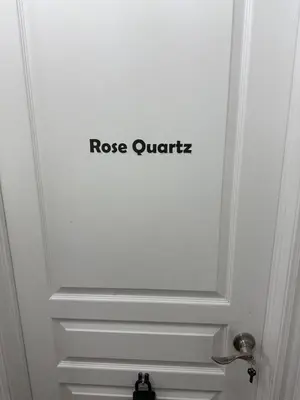 a white door with the wordsrosis quartz on it at Dream Homes in Thorold