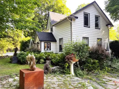 a house with a statue in front of it at The Artists' House Getaway in Collingwood