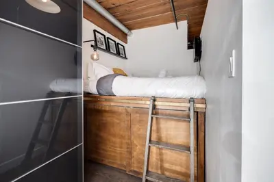 a bedroom with a bunk bed in a tiny house at Downtown 1BR Modern Condo in Toronto