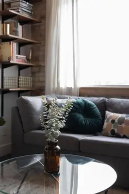 a living room with a couch and a glass table at Downtown 1BR Modern Condo in Toronto