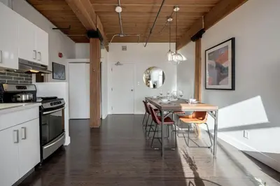 a kitchen with a table and chairs in a room at Downtown 1BR Modern Condo in Toronto