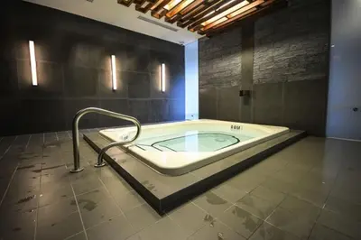 a large bathroom with a bath tub in a room at Luxury Condo with Pool, CN Tower View, Gym, Workspace in Toronto