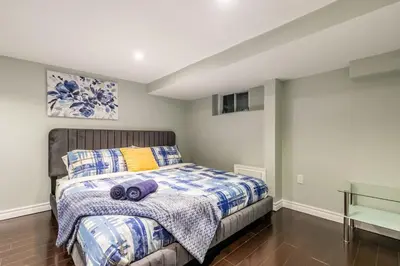 a bedroom with a bed in a room at Chic 3BR apartment in Queen West, Downtown Toronto in Toronto