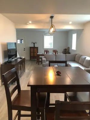 a living room with a couch and a table at Century Home in Bracebridge Muskoka in Bracebridge