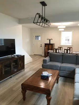 a living room with a couch and a coffee table at Century Home in Bracebridge Muskoka in Bracebridge