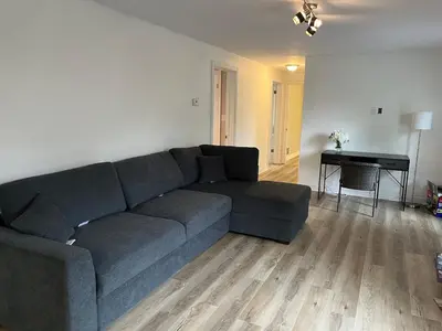 a living room with a couch and a piano at Crystal Beach home in Niagara in Fort Erie