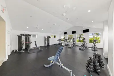 a gym with several treadmills and cardio machines at The Clover - 91 Butternut in Cherry Valley