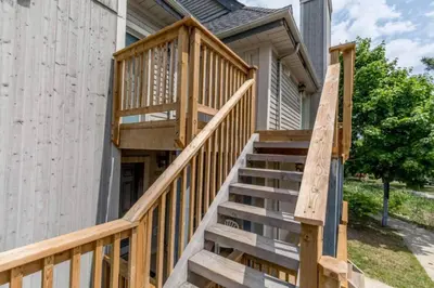 a wooden staircase leading up to a house at Rustic Loft at Blue in Blue Mountains