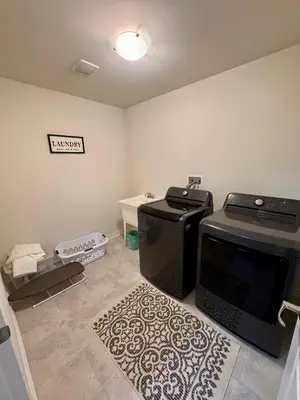 a living room with a microwave and a stove at Whole House 4 Bedrooms 6 beds 3 bath family friendly Quite and relaxation area in Gravenhurst
