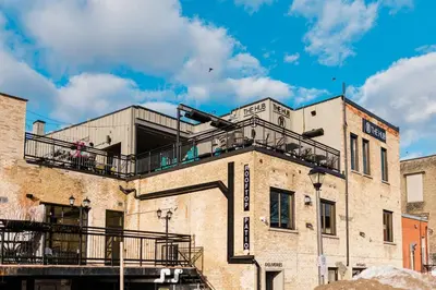 a building with a balcony on top of it at MR Loft formerly The Lehman Studio Stratford in Stratford