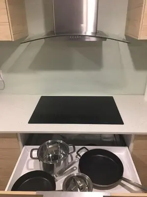 a stove top with two pots and pans on it at Upscale 2-Bedroom Basement Apartment in London