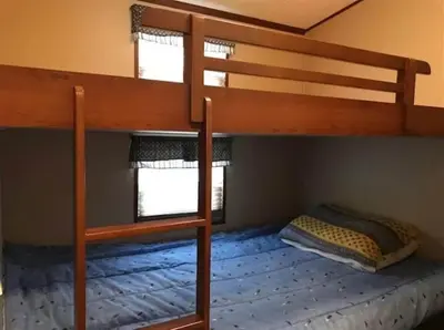 a bedroom with two bunk beds in a room at Westlake Dunes View Beach-FREE Pontoon Boat Rental in West Lake